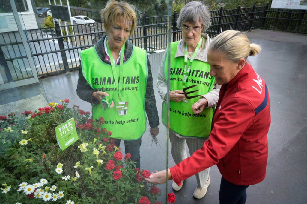 LNER staff and Samaritans volunteers planting floral displays at Durham Railway Station
