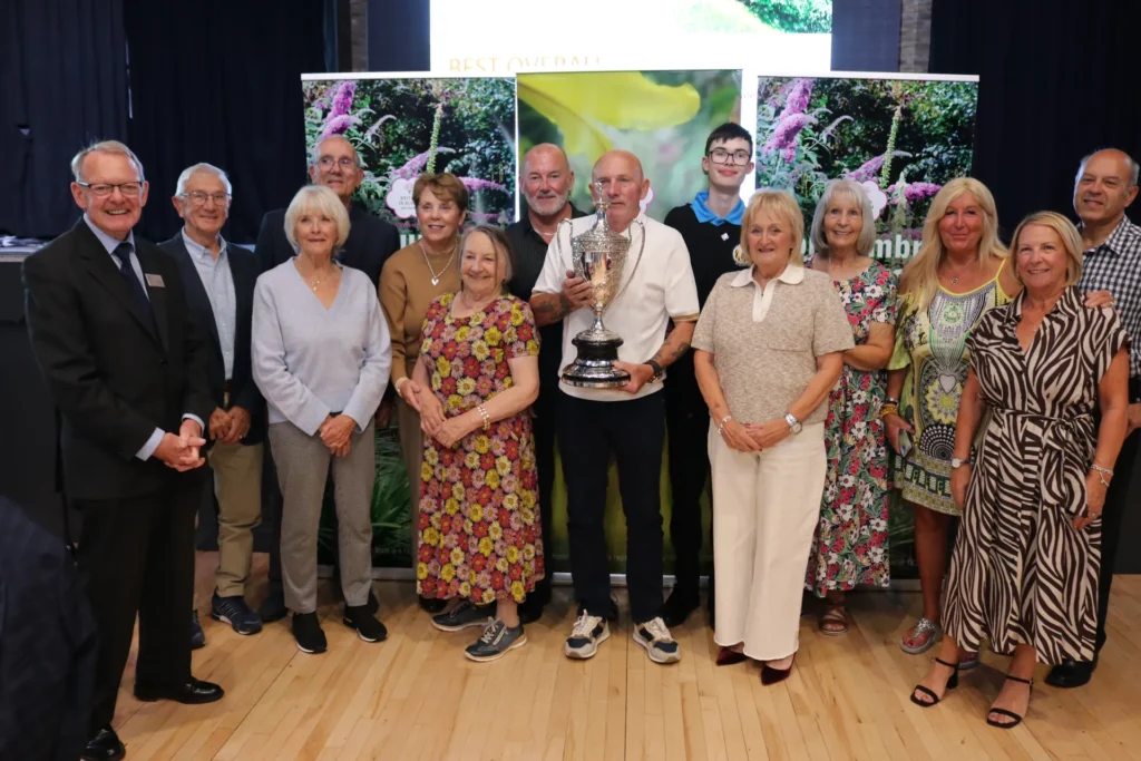 Award winners gathered together with their trophies at the 2026 presentation of awards
